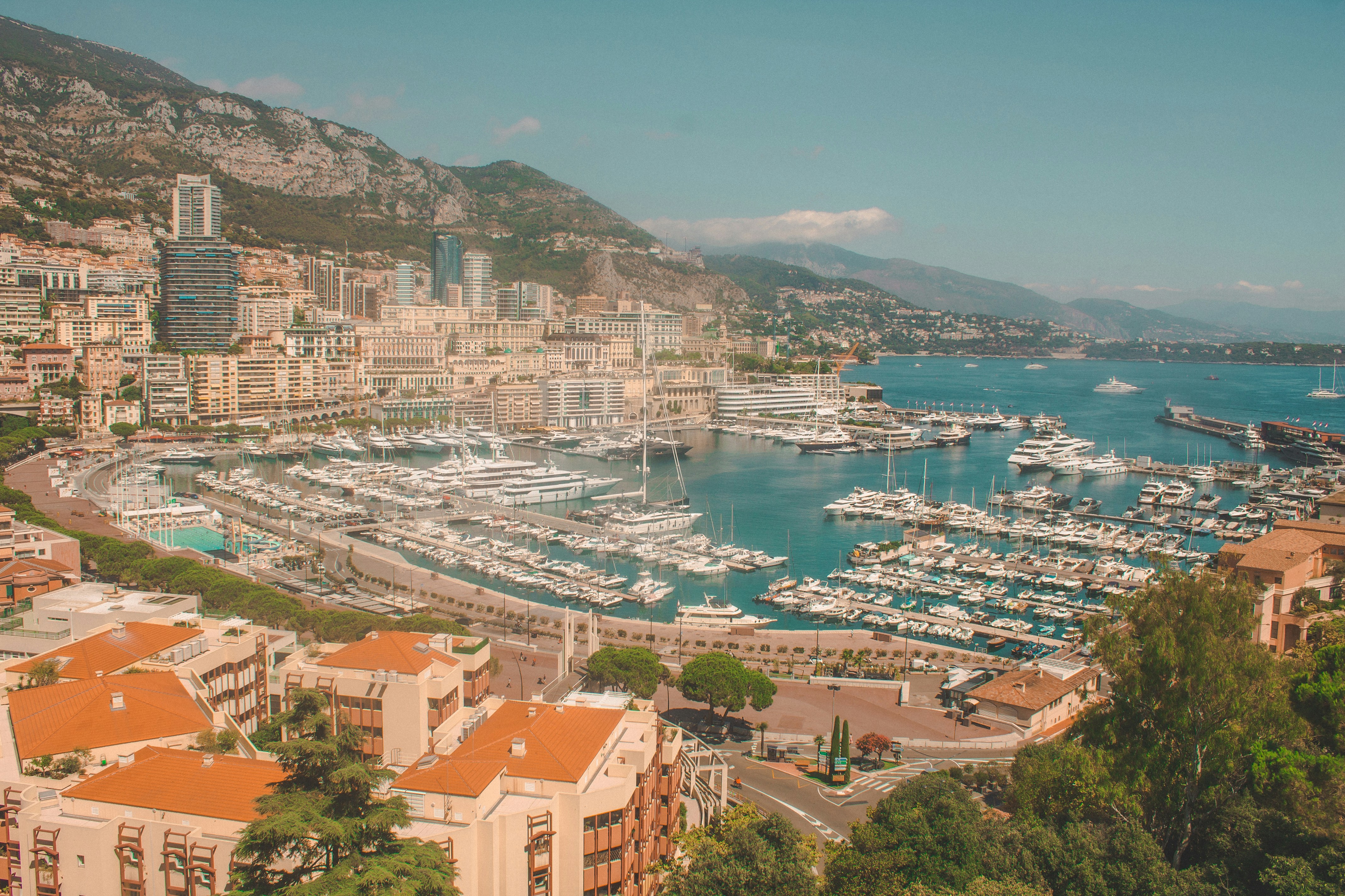 An aerial shot of Monaco’s city buildings overlooking the iconic Port Hercule