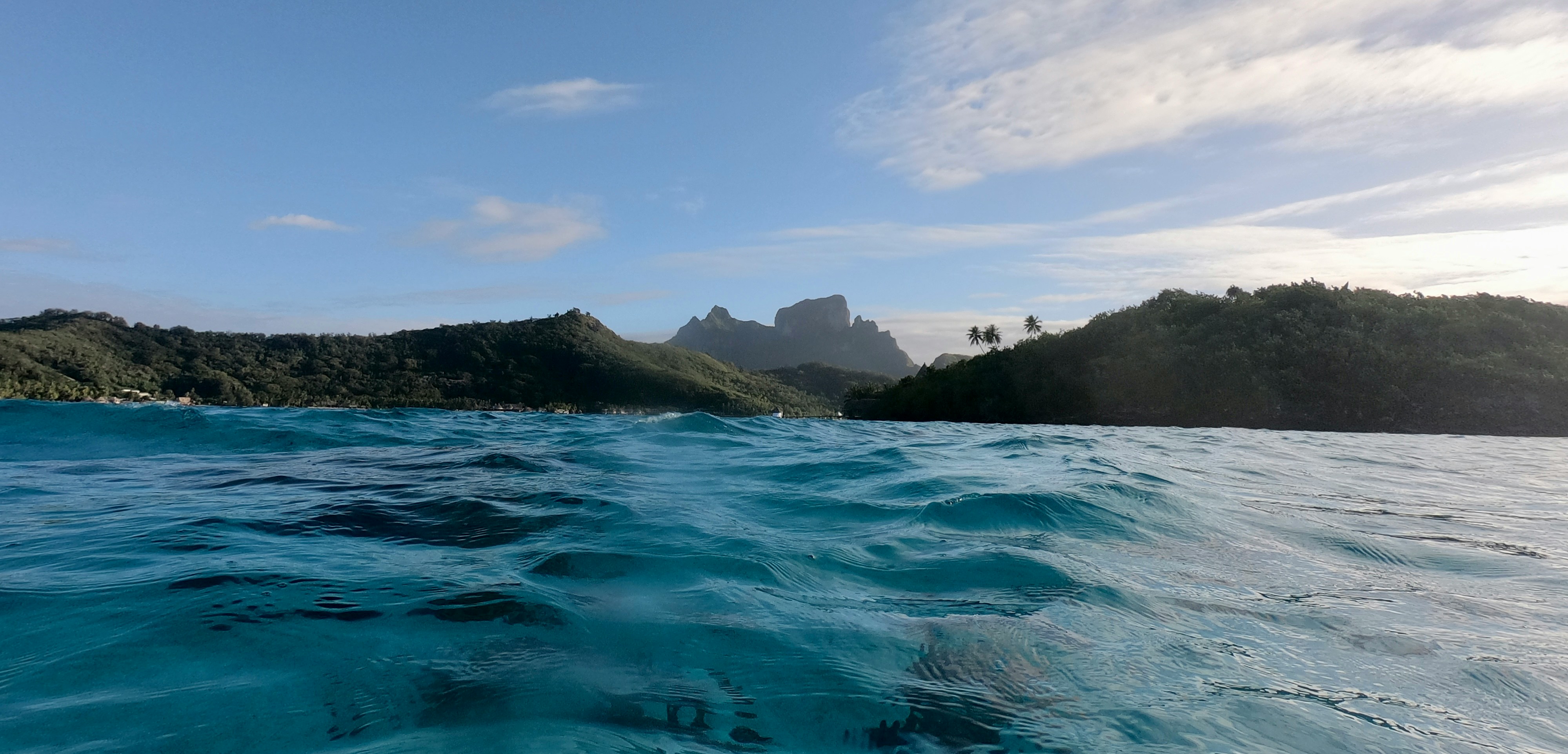 A view of the ocean facing a small island in Tahiti