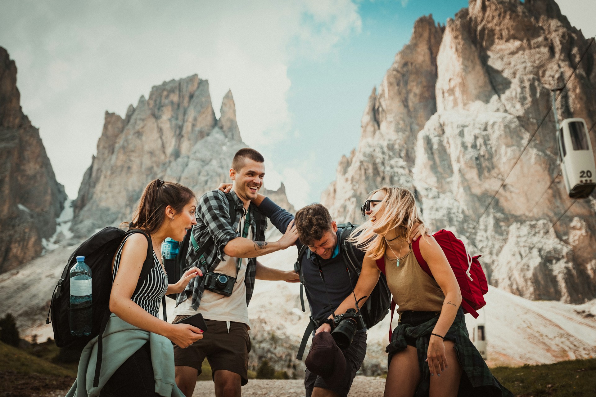 A group of travellers posing in front of high mountains