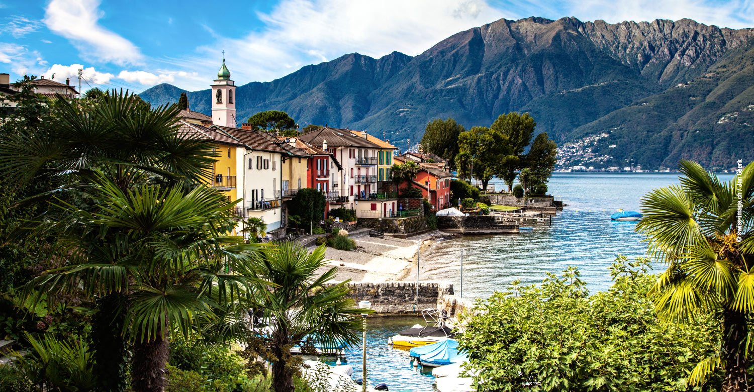 Small harbor with colorful row of houses on Lake Maggiore, Gerra (Gambarogno).