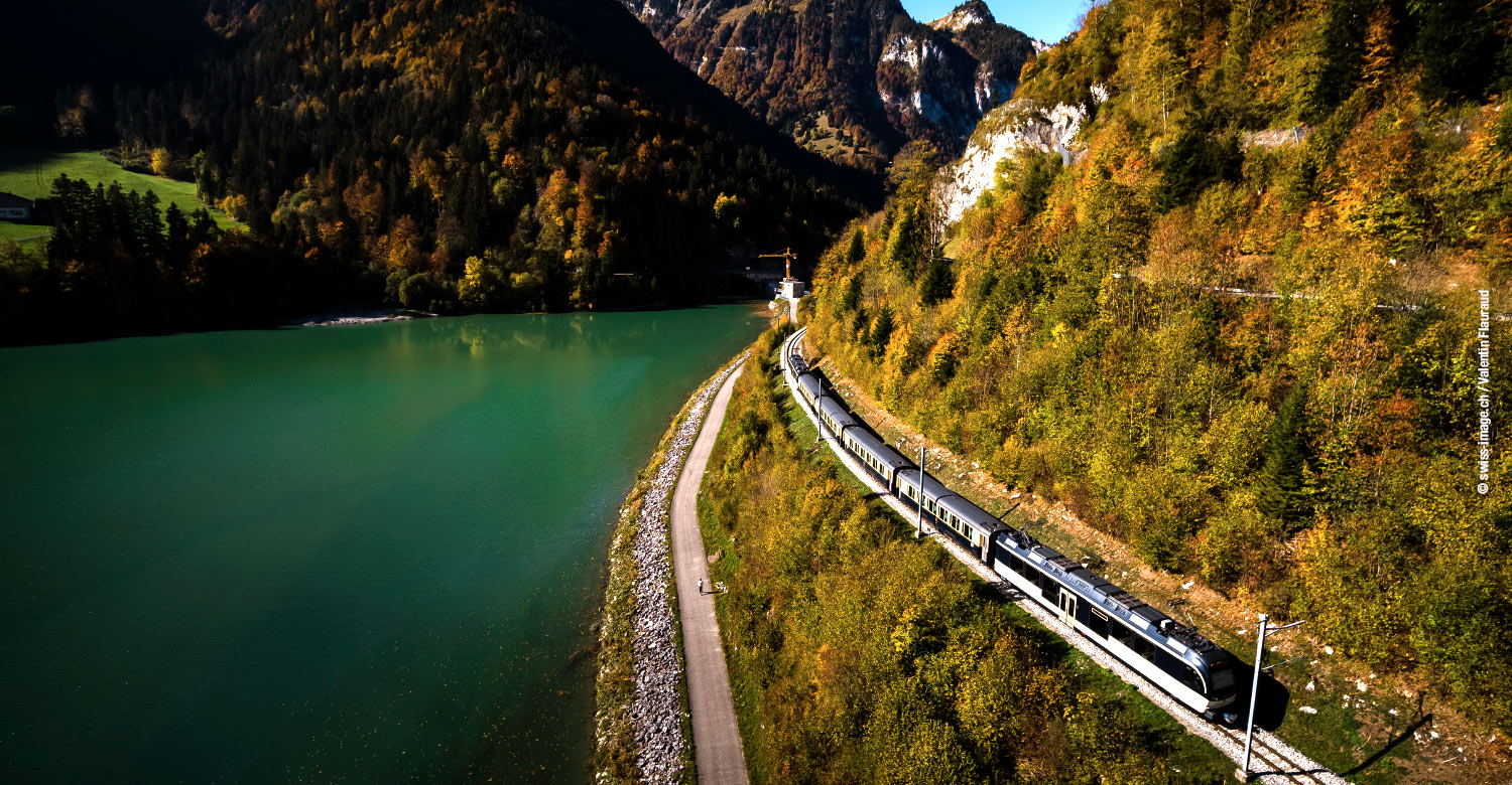Chocolate Train traversing through majestic scenery.