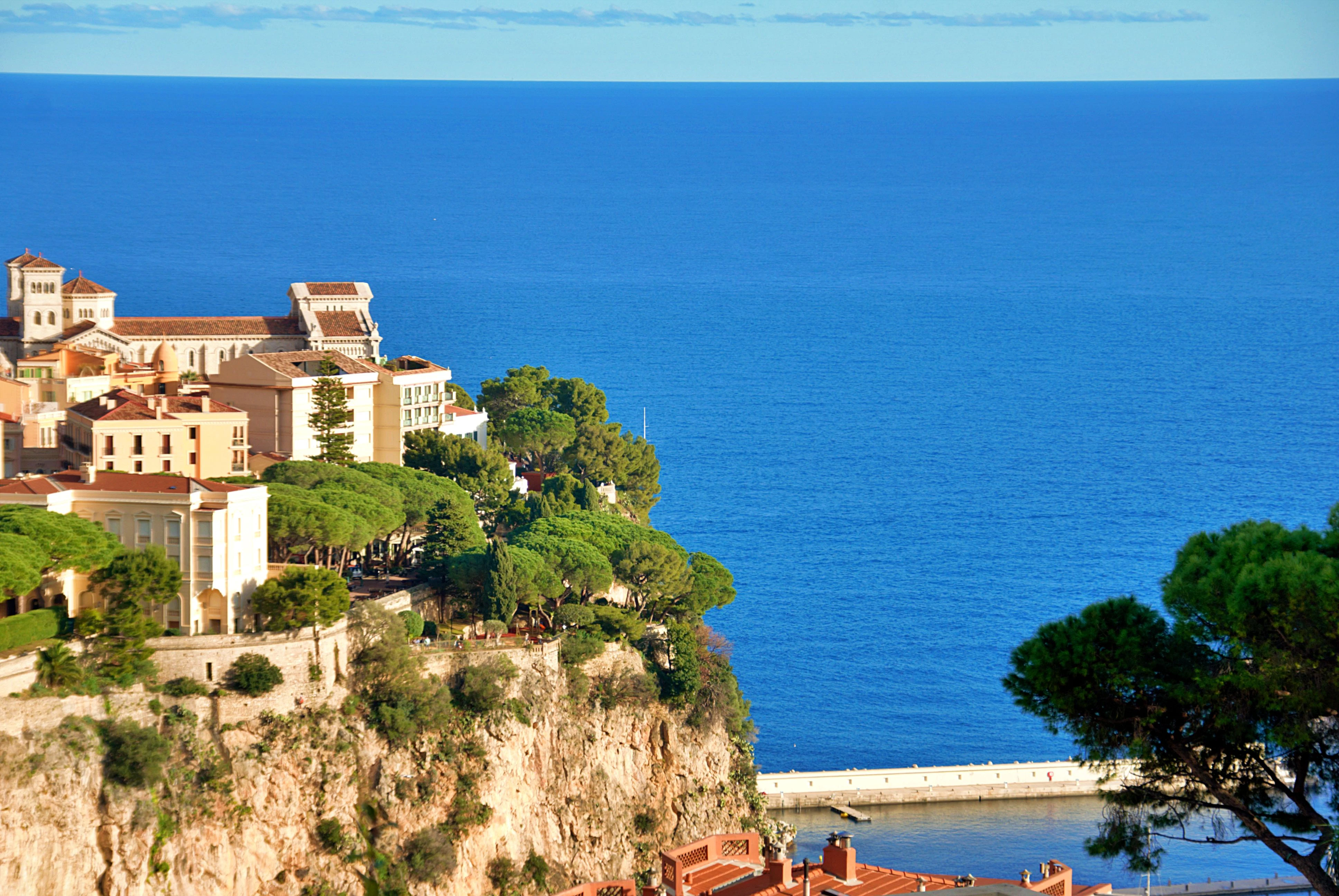 Elevated view of Monaco's dramatic coastline, Mediterranean waters and Riviera hillside landscape