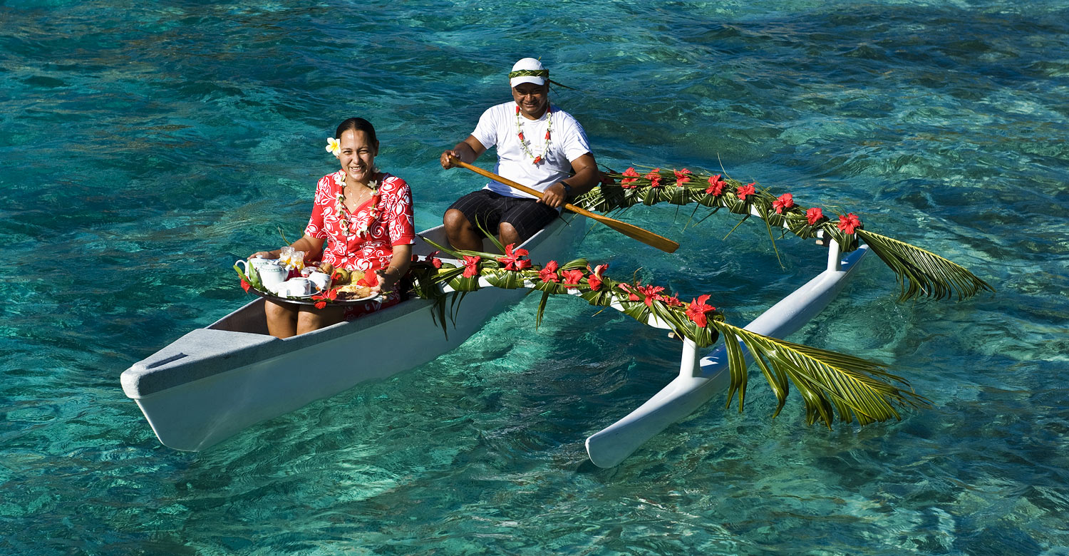 Breakfast being delivered by a canoe