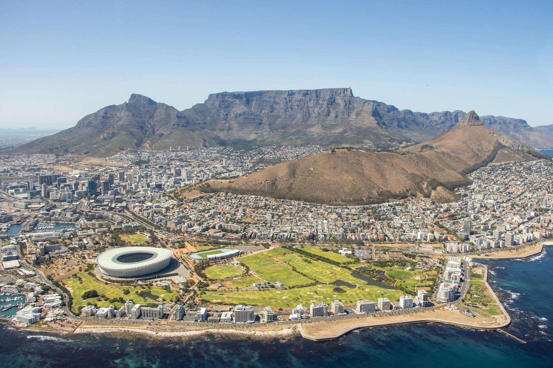 An aerial shot of the iconic Table Mountain dominating over Cape Town.
