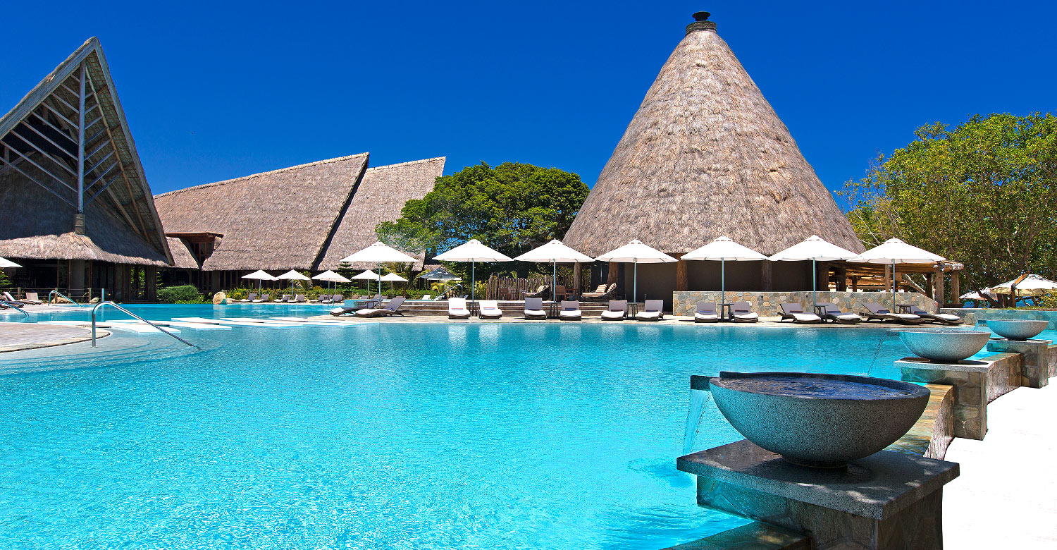 Lounging by the pool at the 5-star Sheraton New Caledonia Deva Resort