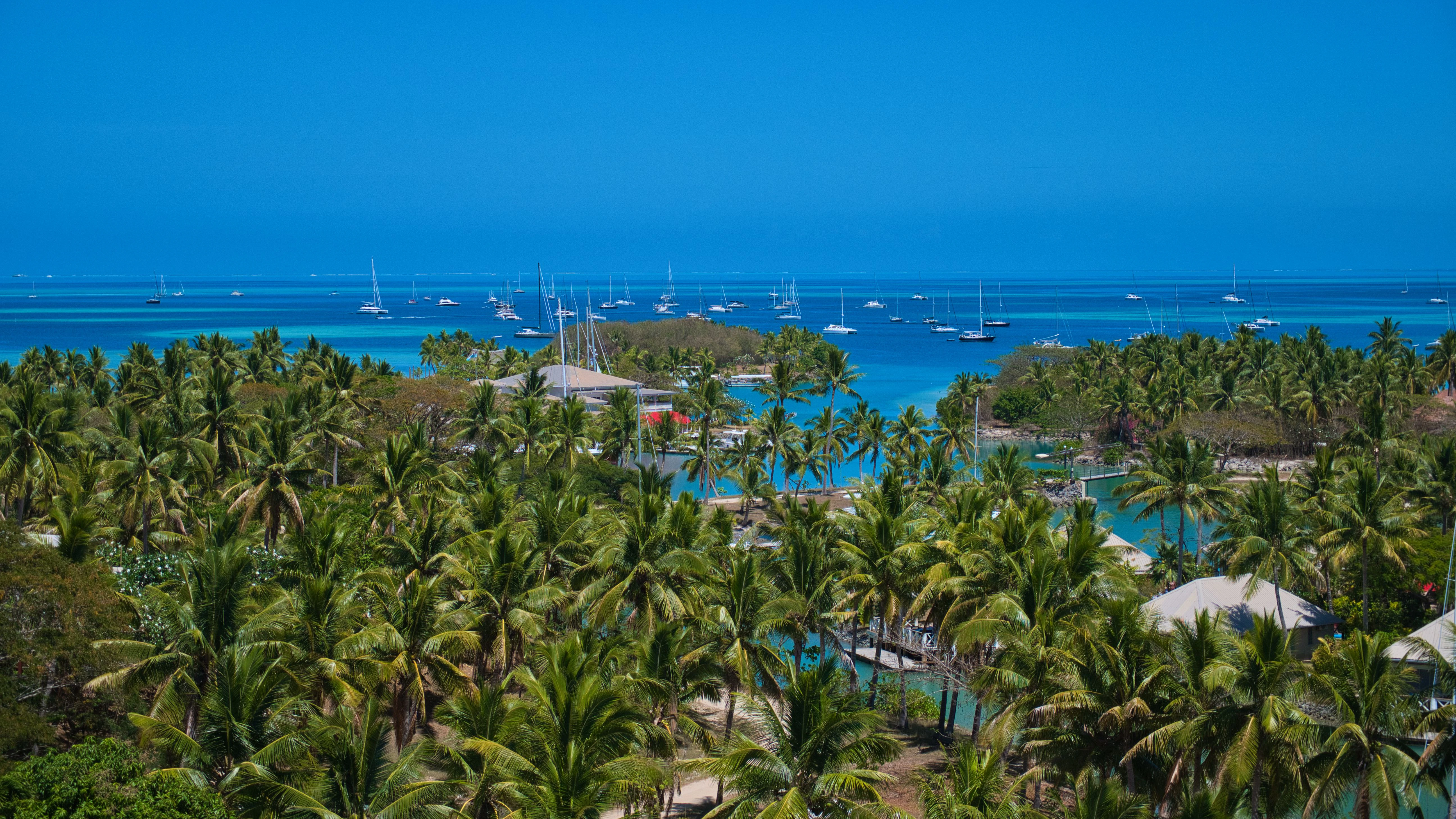 Aerial view of Fiji's tropical islands surrounded by turquoise lagoons, coral reefs and pristine South Pacific waters