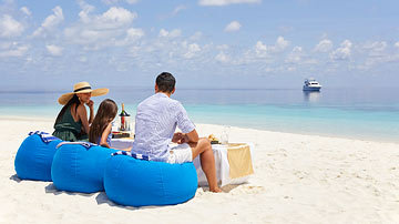 A family enjoying a holiday at Conrad Maldives Rangali Island